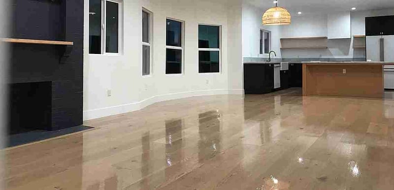 How often should hardwood floors be professionally cleaned?