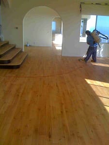 Vacuum sanded wood floor thoroughly